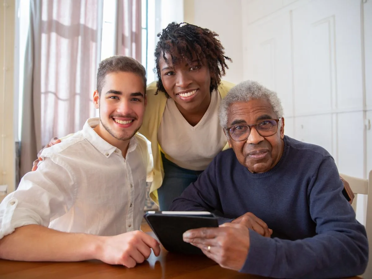 Care team members with a client at home